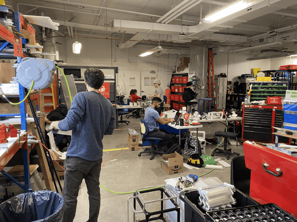 Basit collaborating with team members